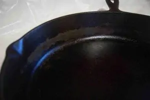 partial corner of black cast iron pan