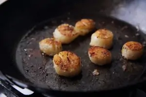scallops in cast iron pan