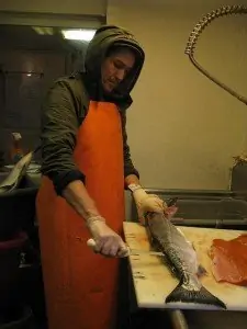 fisherman cleaning a fish