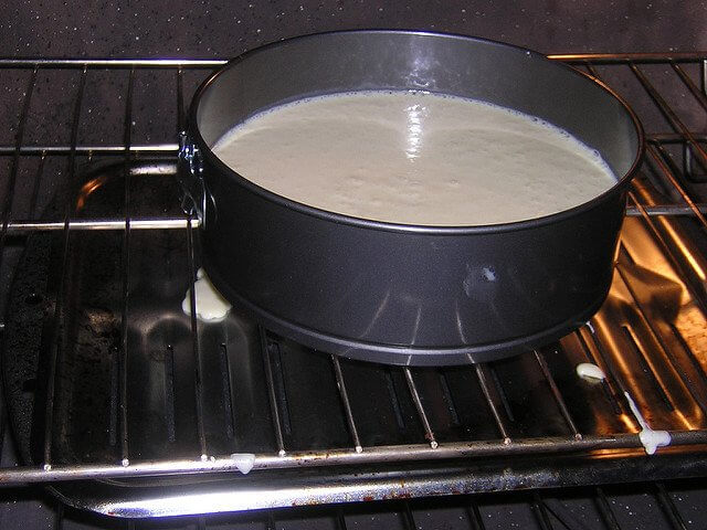 Cheesecake baking in a springform pan.