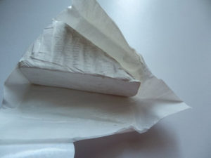 brie cheese in paper