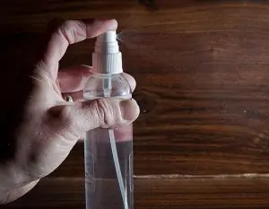 hand holding spray bottle