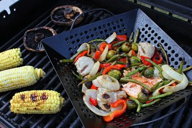 A grill basket keeps your veggies from slipping through the cracks!