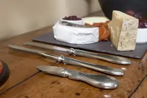 Many types of cheeses and knives