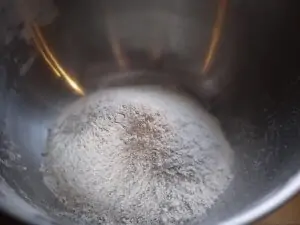 sifted white flour in a metal mixing bowl