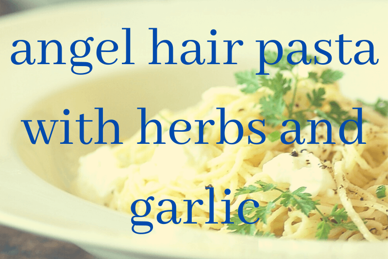 angel hair pasta in white bowl with parsley