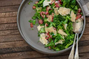 Broccoli bacon salad on white plate