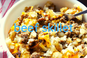 bowl of beef, onions, cheese, and vegetables