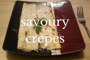 two crepes on red plate