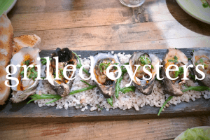 rectangular dish of grilled oysters
