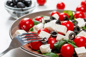 mozzarella and tomato salad on white table