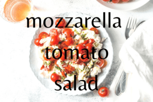 mozzarella and tomato salad on white table