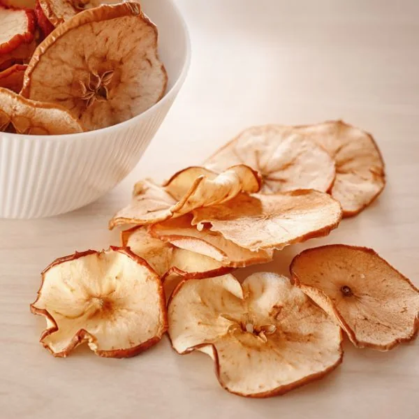 dehydrated apple chips in a bowl