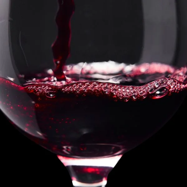 wine being poured into a glass