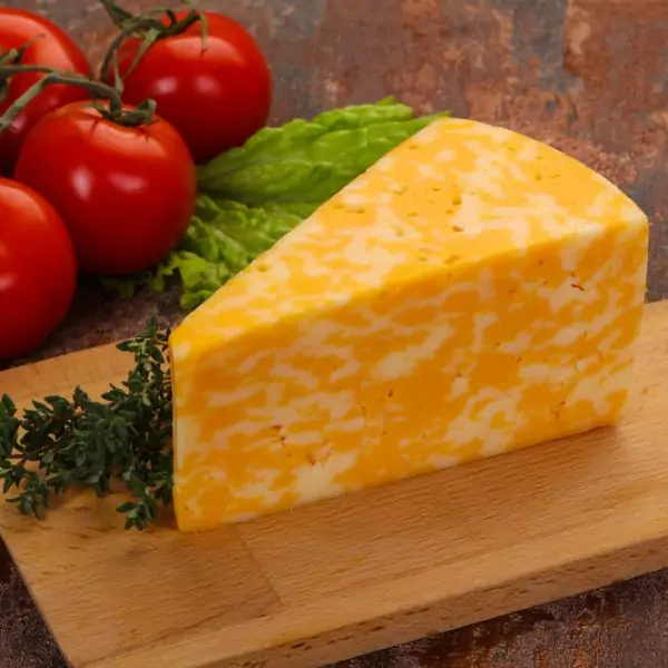 Monterey Jack Cheese slice on a cutting board