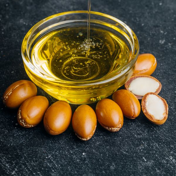 a cup of argan oil with seeds