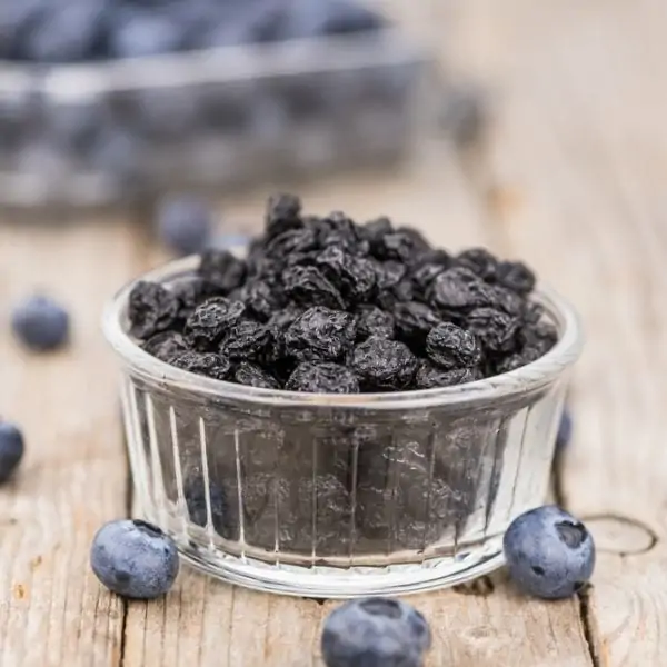 dehydrated blueberries on a wooden surface