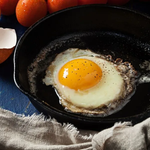 basted eggs in a pan full of oil or butter