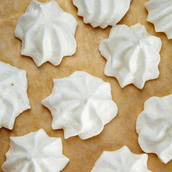 italian meringue cookies on a baking sheet