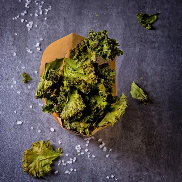 kale chips wrapped in a paper bag