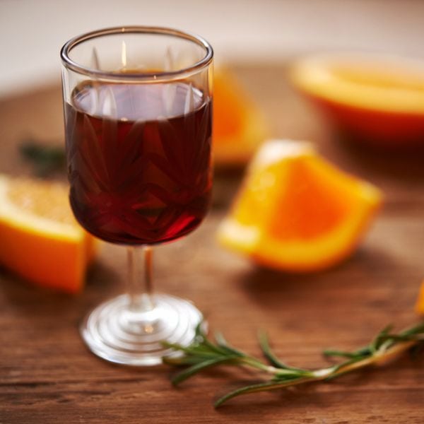 Port wine with a bunch of slices of orange