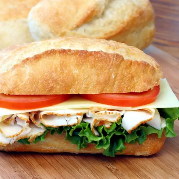 Turkey sub sandwich on a wooden surface