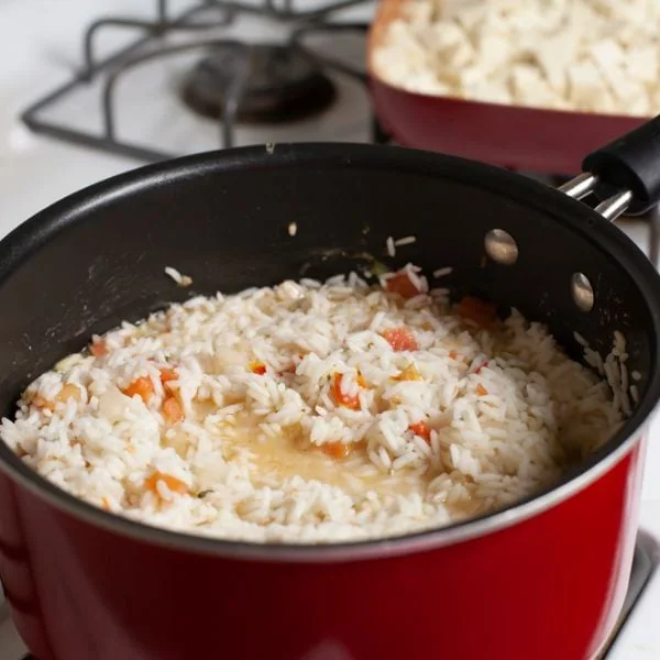 Rice in a red pot on the stove