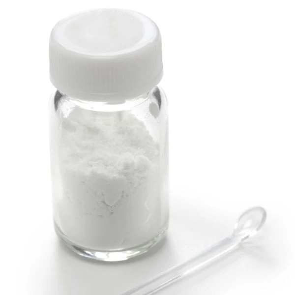 Cream of Tartar in a small vial on a white background
