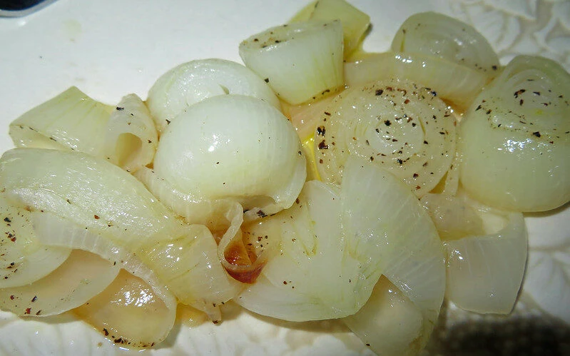 Baked onions on a white plate