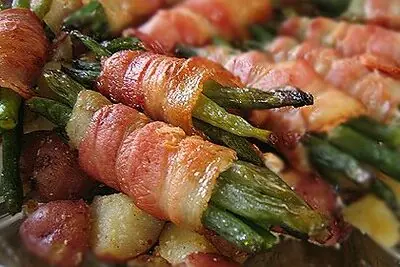 Green bean casserole wrapped in cooked bacon
