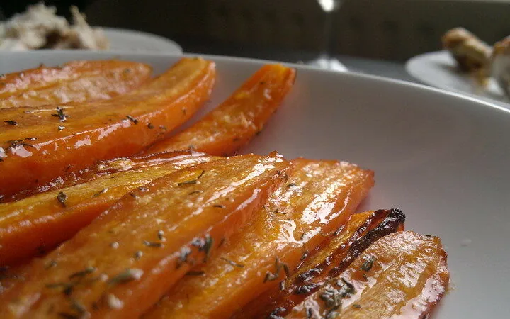 Honey roasted carrots on a white plate
