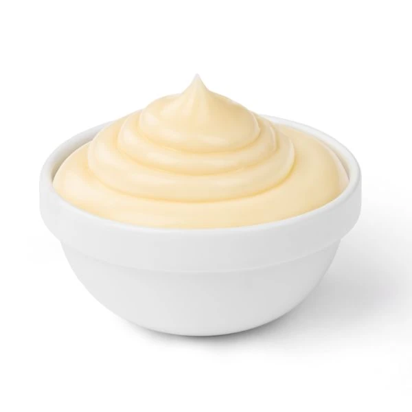 Mayo in a small sauce bowl against a white background