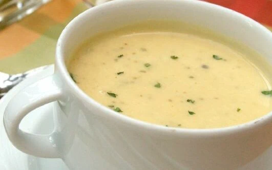 Potato soup in a white mug