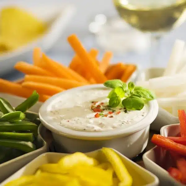 Ranch dressing in the middle of sticks of vegetables