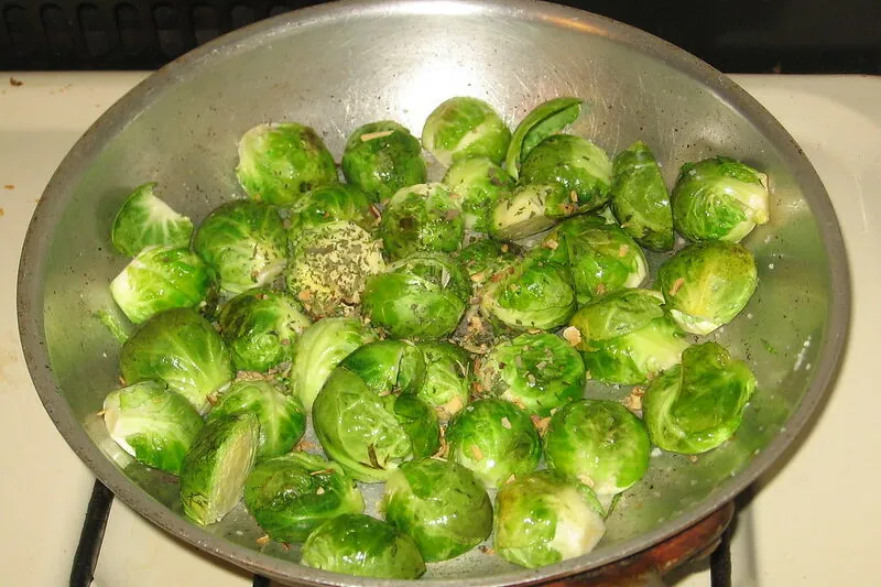 Sauteed brussel sprouts in a silver bowl