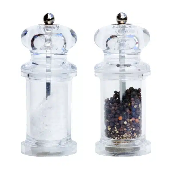 Clear salt and pepper grinders on a white background