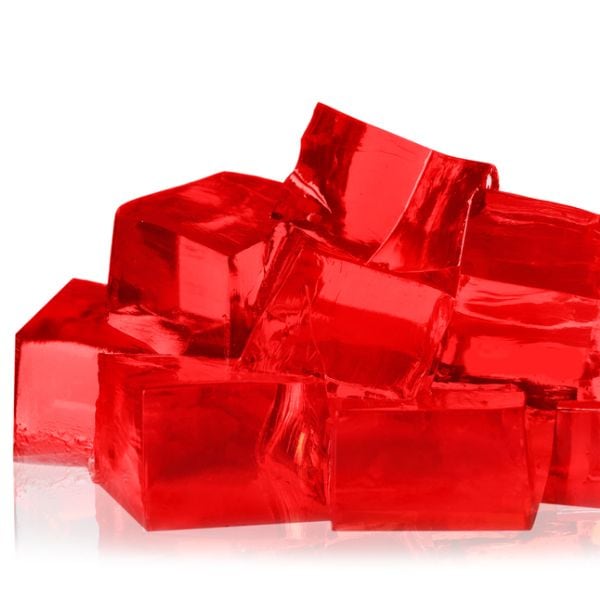 Multiple cubes of jello on a white background