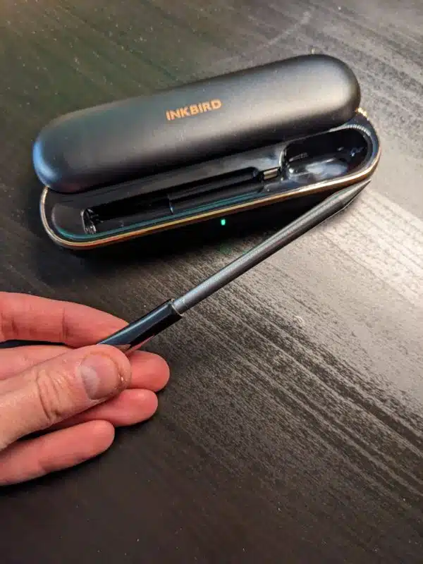 INKBIRD INT-11P-B probe being held outside of its charging case
